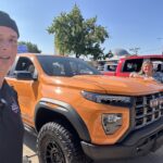 Dave and Kelly with the 2025 GMC Canyon AT4X AEV at the State Fair of Texas